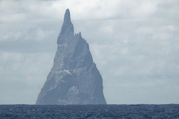 r/StrangeEarth - This peak amid the Pacific Ocean is taller than it is wide (562 m in elevation vs 300 m across): it looks like a fantasy novel place and it really exists. It's called Ball's Pyramid.