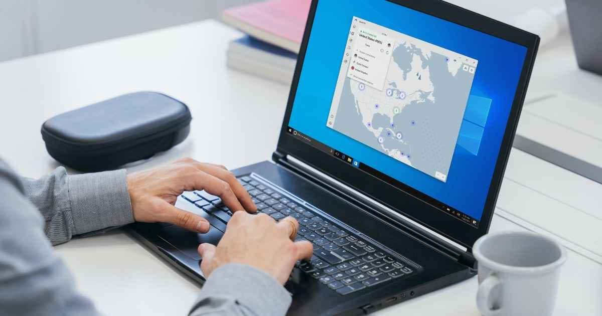 man using a laptop connected to Nord VPN