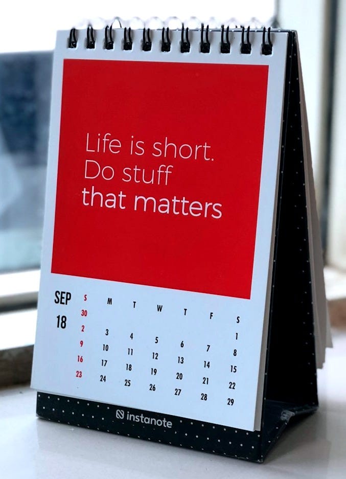 spiral freestanding calendar on white surface