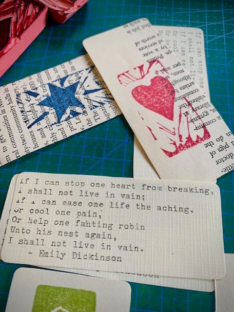 Two photos of small cards with poems by emily dickinson and william carlos williams typed on them