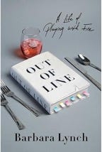 A book with a glass of liquid and spoons

Description automatically generated