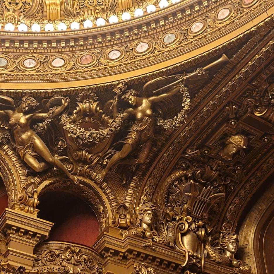 A gold ornate ceiling with statues and ornate decorations

AI-generated content may be incorrect.