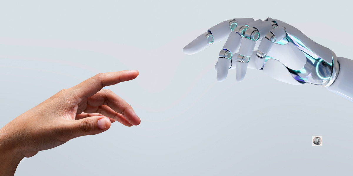 a hand reaching out to touch a robot hand