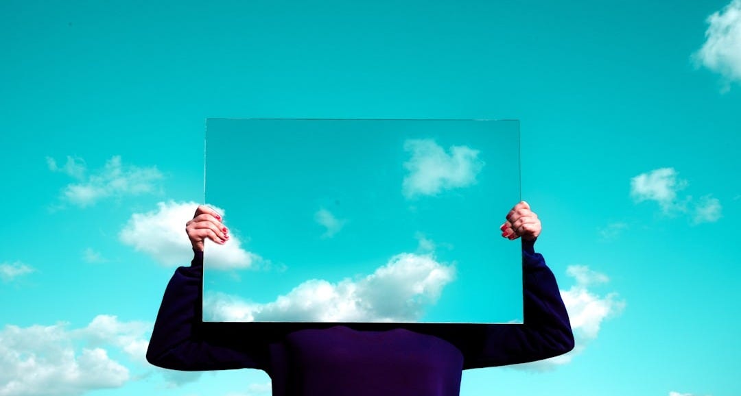man in black suit jacket raising his right hand man in black suit jacket raising his right hand