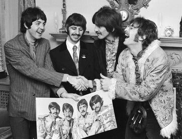 Photo of The Beatles at the 1967 Sgt. Pepper’s album launch party.