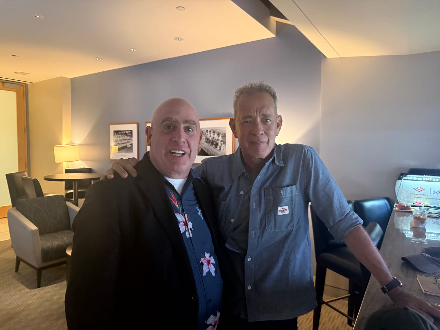 A photograph of Joe Posnanski and Tom Hanks at the Dodgers game. A photograph of Joe Posnanski and Tom Hanks at the Dodgers game.