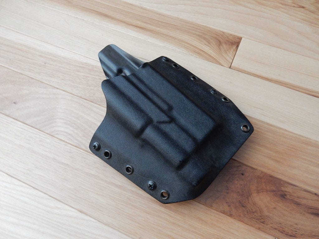 A Raven Concealment holster for my Glock 19 with a Streamlight TLR-1 light
