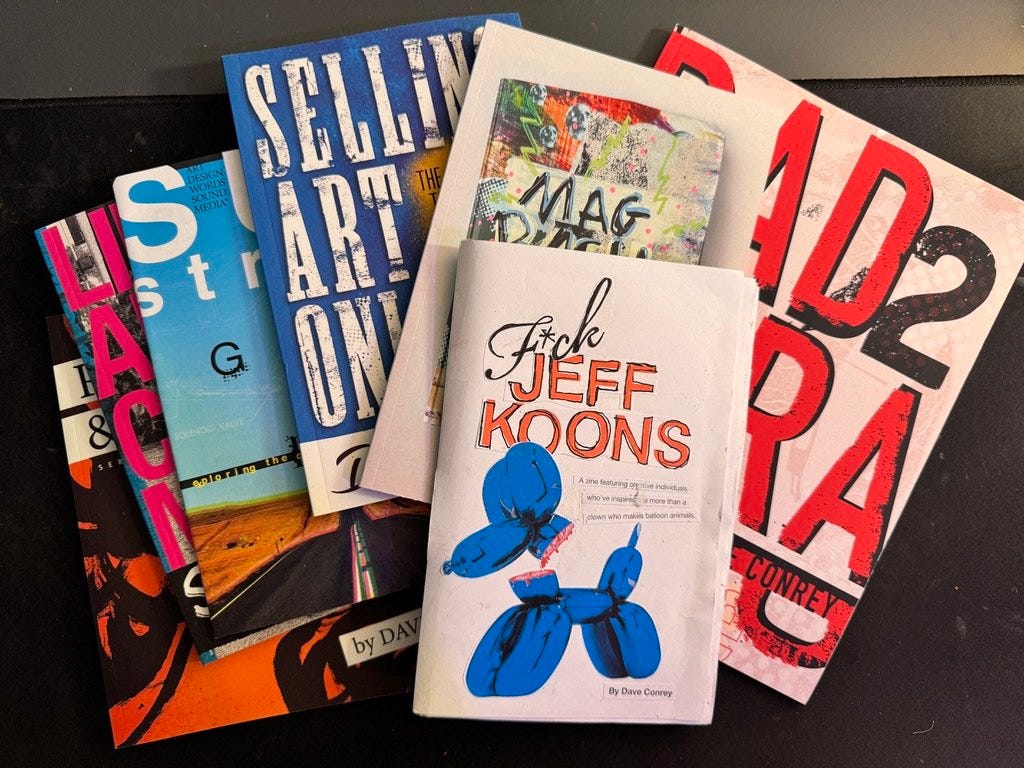 Stack of colorful indie zines and small art books with bold graphic covers spread across a table. Stack of colorful indie zines and small art books with bold graphic covers spread across a table.