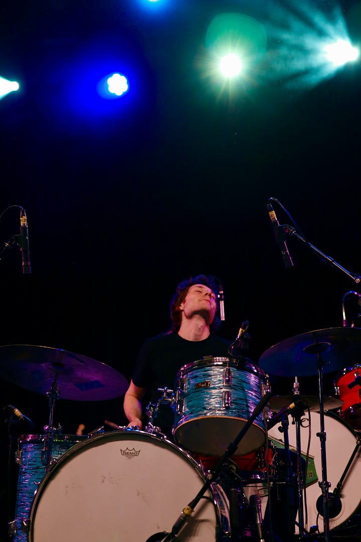 Finom performs under colorful lights