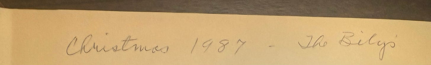 A writing that says Christmas 1987 in the first pages of a book