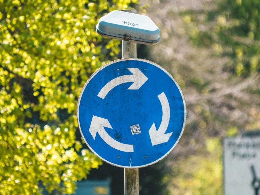 blue and white road sign