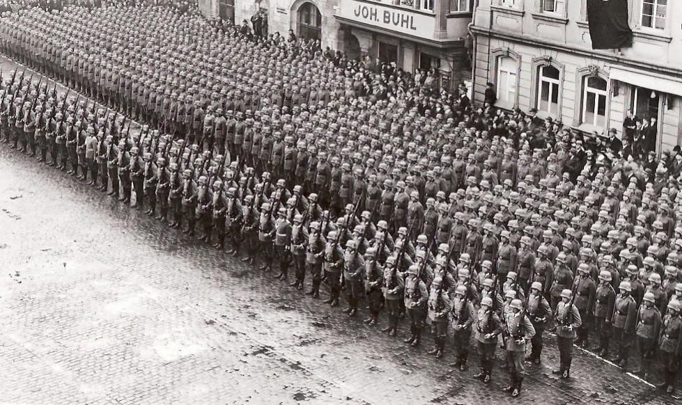 Aerial view of hundreds of German troops in perfect order, possibly from WWII