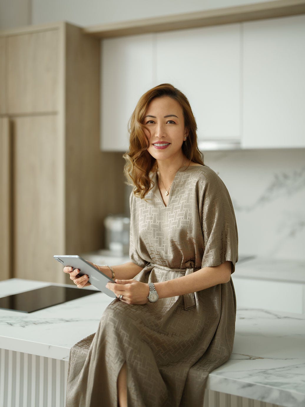 Dr Angeline Yong holding an ipad. Dr Angeline Yong holding an ipad.
