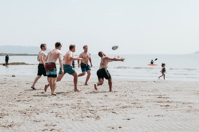 Men playing on the beach