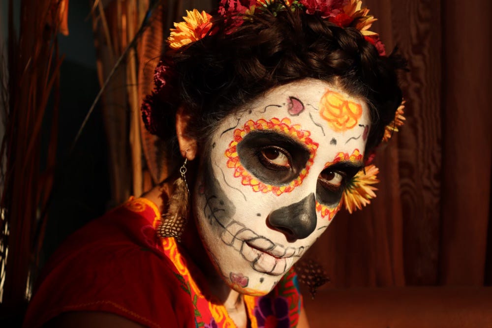 A woman's face poianted like a skull for Dia de los muertos A woman's face poianted like a skull for Dia de los muertos