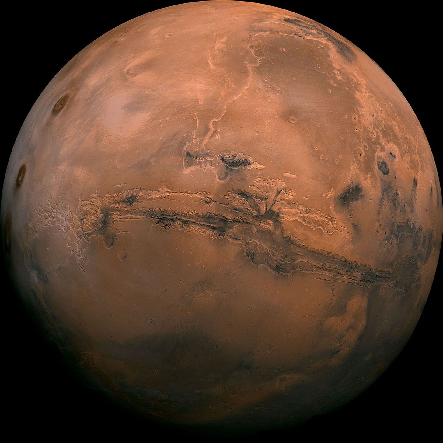Full disk color image of Mars showing Valles Marineris canyon and volcanoes. Full disk color image of Mars showing Valles Marineris canyon and volcanoes.