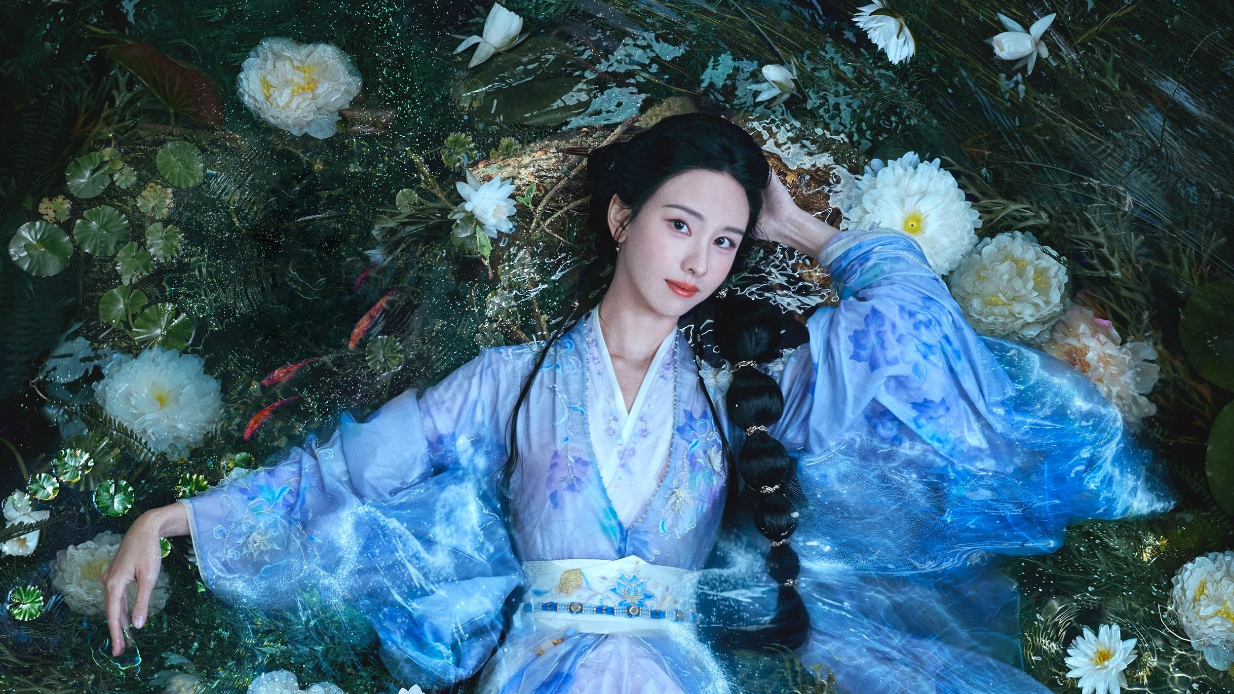 Chen Duling in hanfu lying in a lotus pond