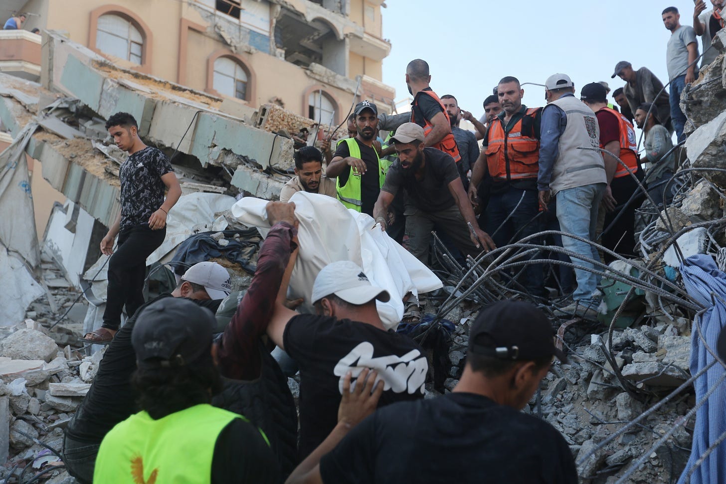 Gaza Civil Defense teams recover a body of someone killed in the Al-Saada building collapse. Photo by Ahmad Hasaballah/Getty Images