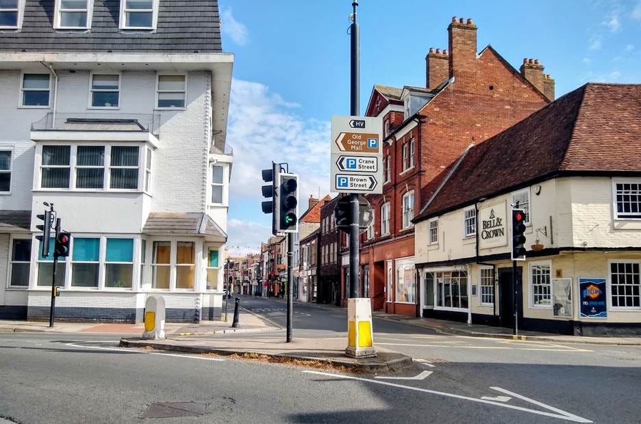 A street with buildings and traffic lights
AI-generated content may be incorrect. A street with buildings and traffic lights
AI-generated content may be incorrect.