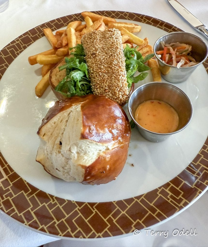 sesame crusted fish on a brioche bun 