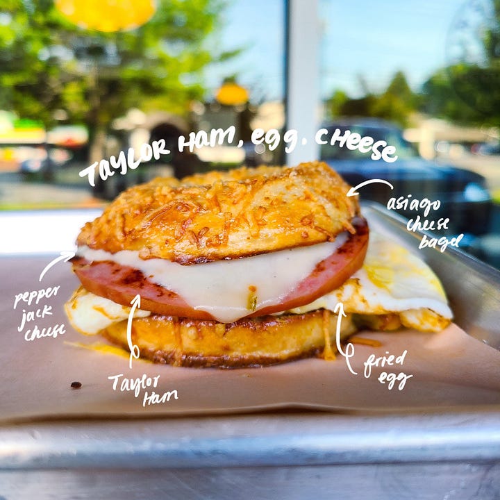The Good Wurst Company Taylor Ham, Egg, Cheese on Asiago Cheese bagel