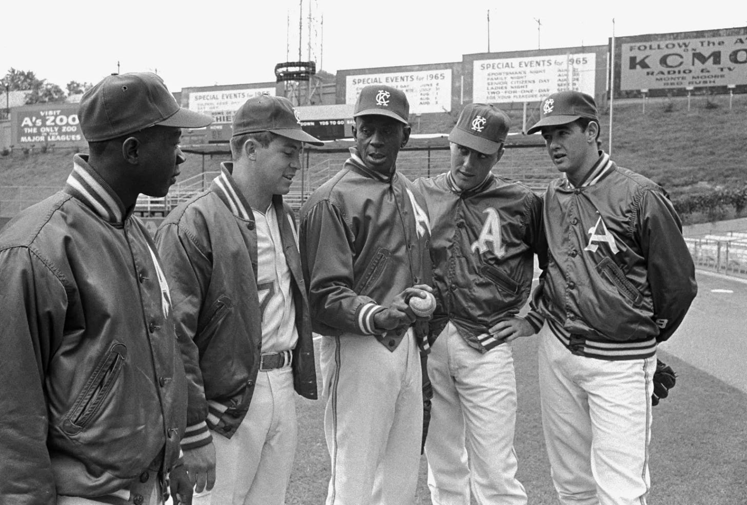 Satchel Paige talks pitching with a group of youthful A's.