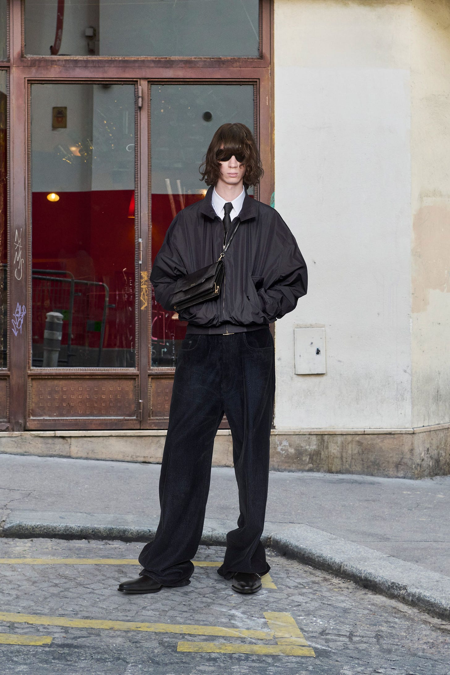 Image may contain Trace Cyrus Person Standing Clothing Pants Coat Jacket Adult Accessories Formal Wear and Tie