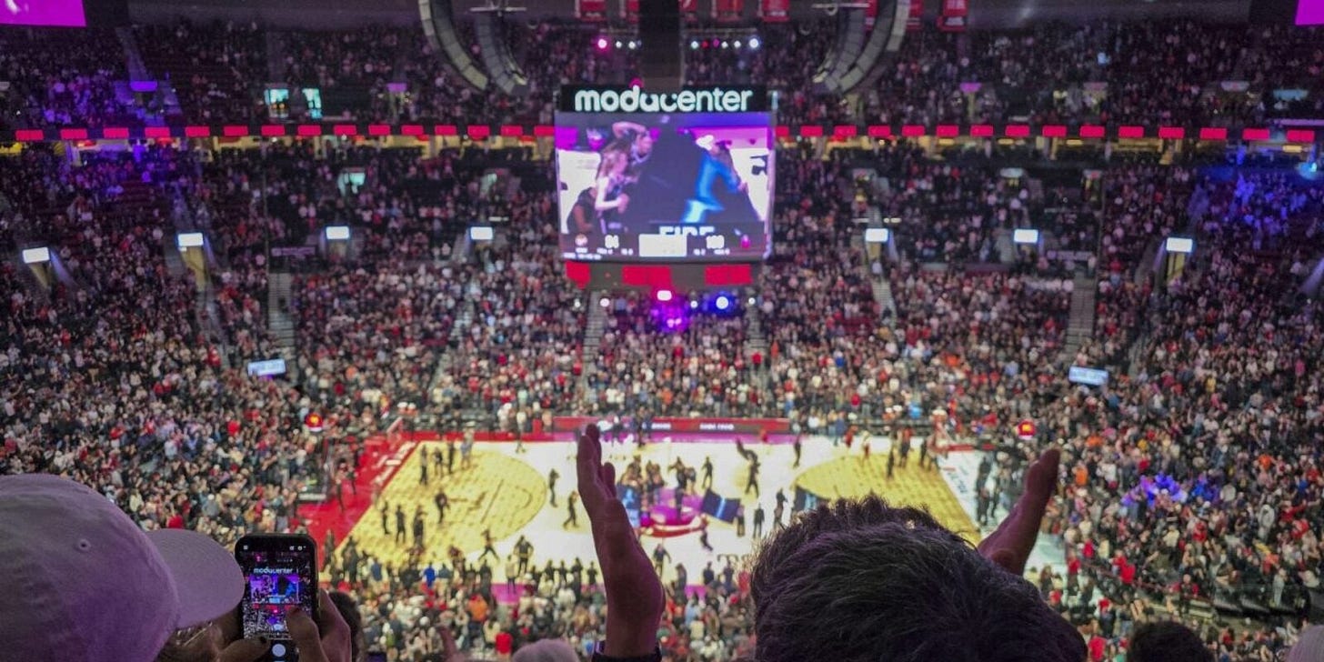 Joyous fans cheer for the Portland Fire inside the Moda Center. Joyous fans cheer for the Portland Fire inside the Moda Center.