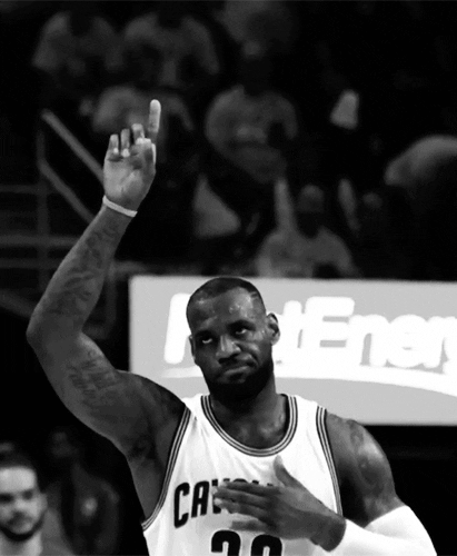 LeBron James points to the sky and taps his chest. LeBron James points to the sky and taps his chest.