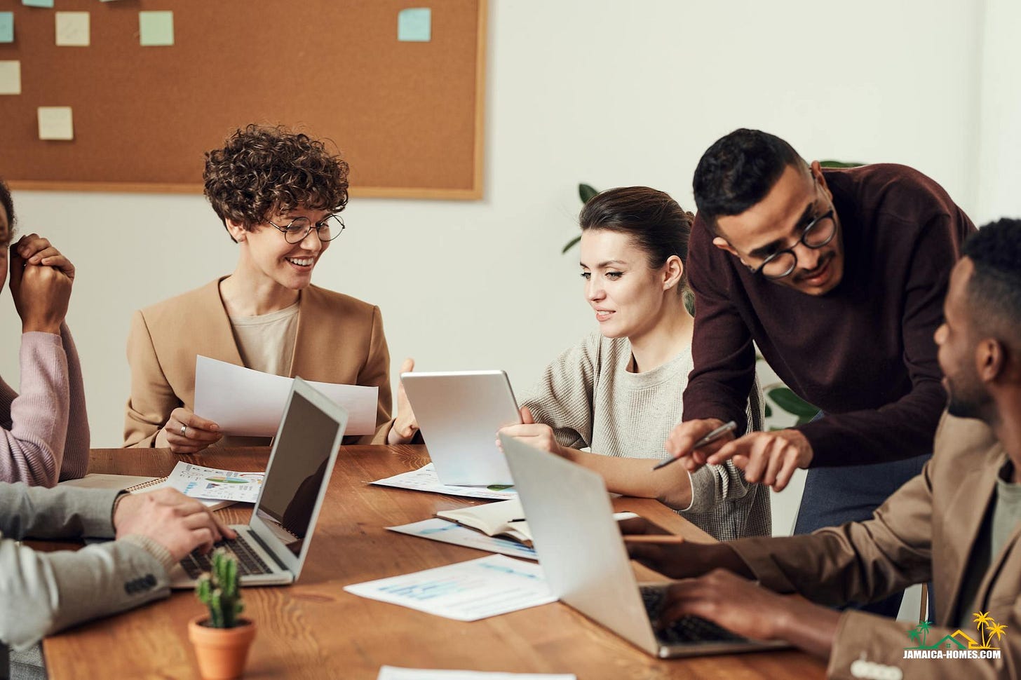 group of people gathered around wooden table
