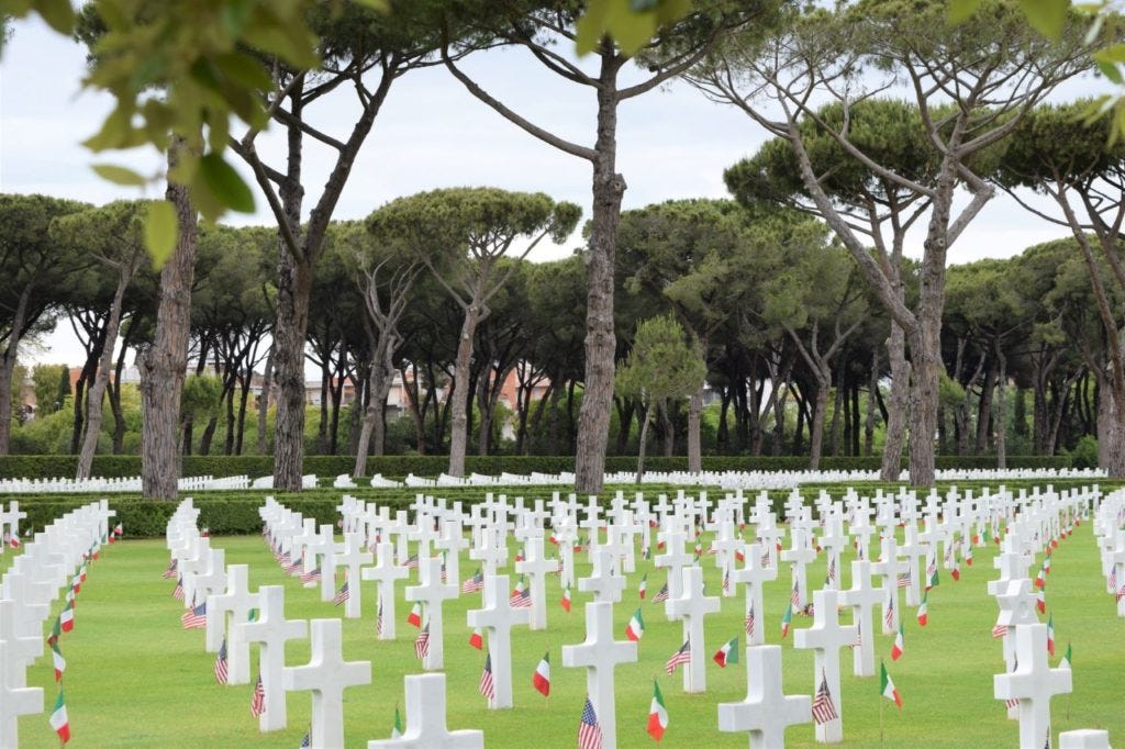 cemetery with rows of white crosses