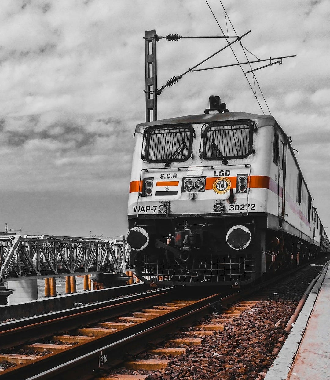 white and black train on rail tracks