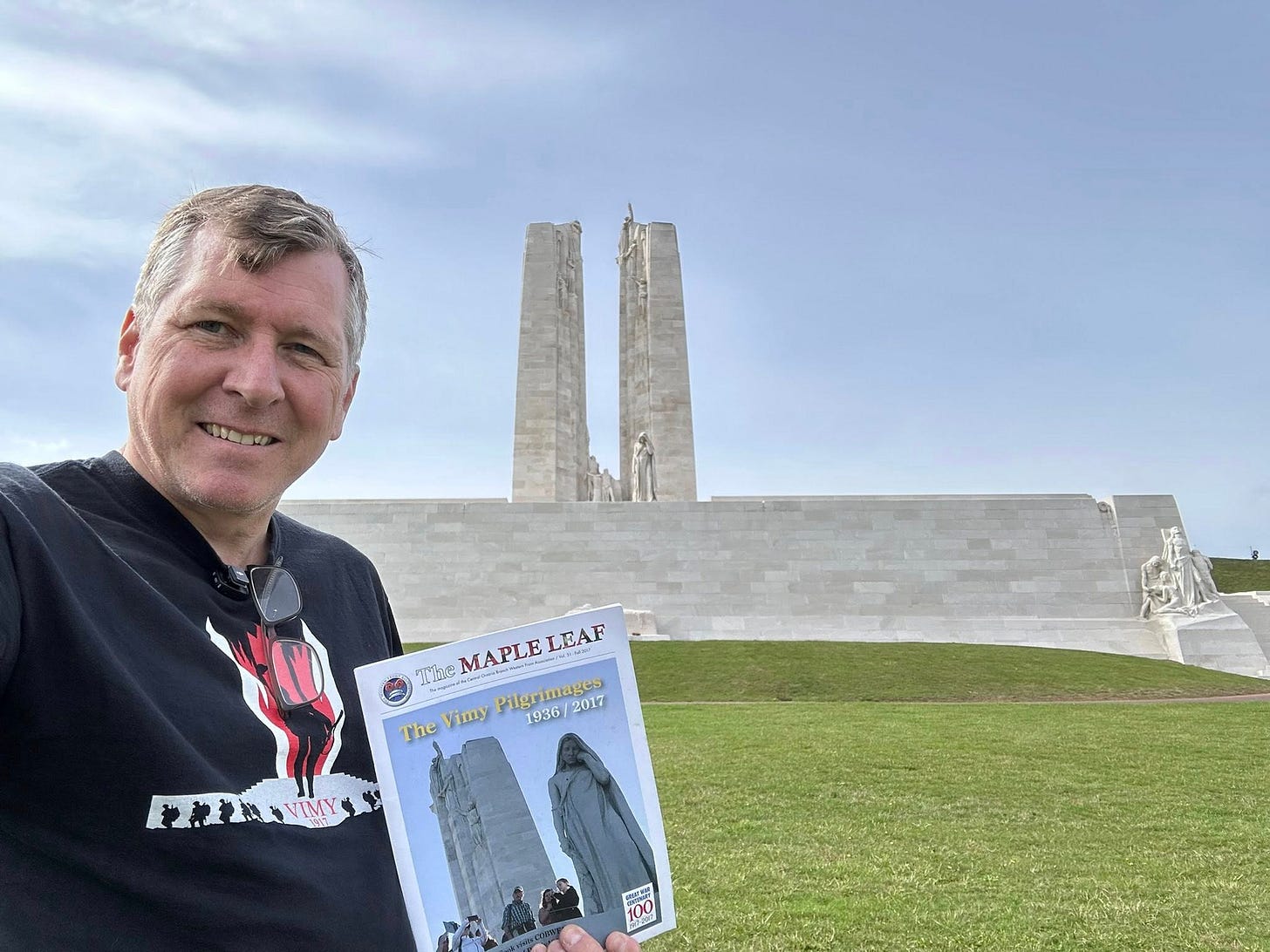 May be an image of 2 people, monument and text