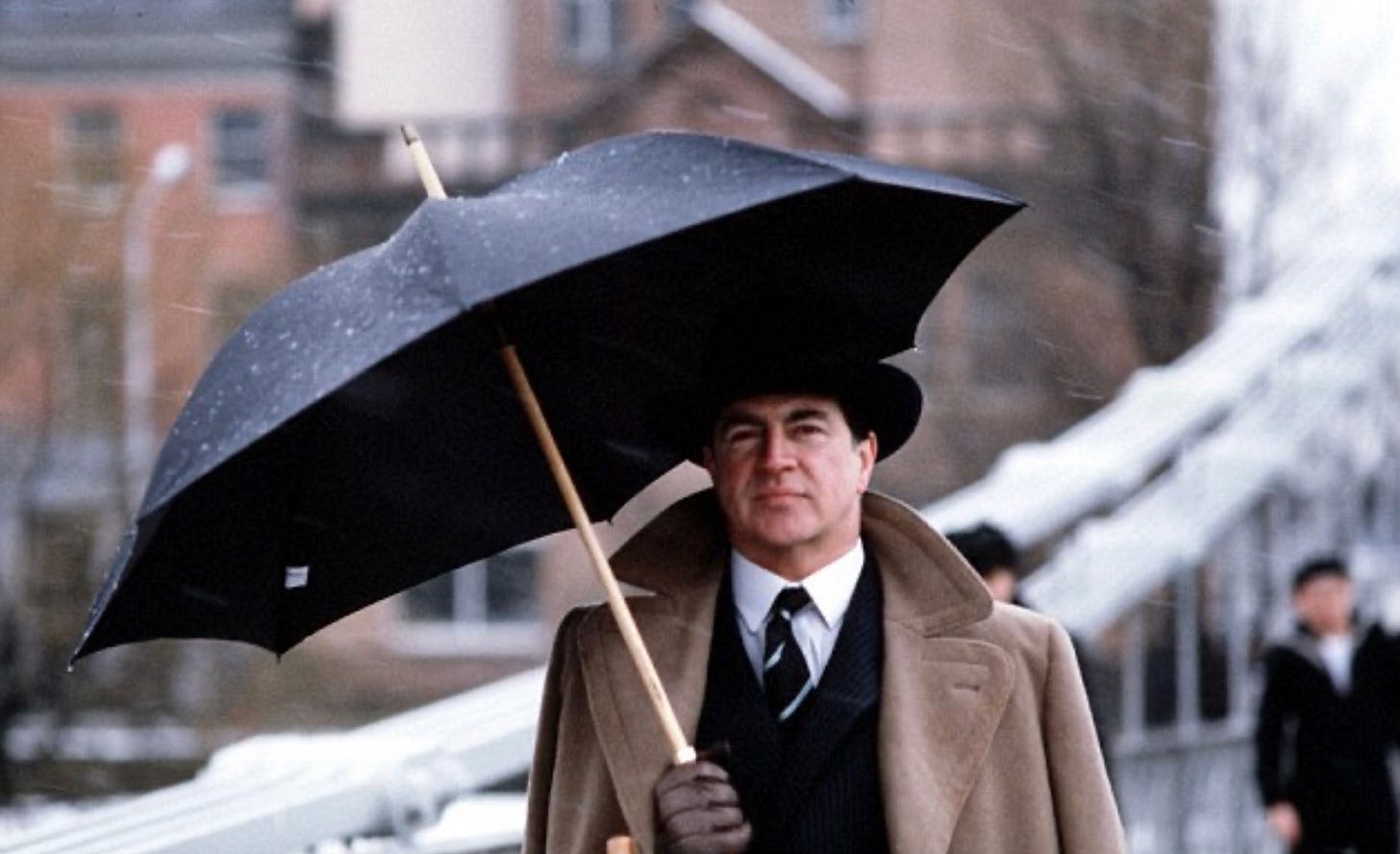 A man under an umbrella. (Alan Bates as Guy Burgess) A man under an umbrella. (Alan Bates as Guy Burgess)