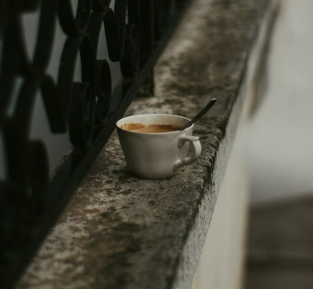 white ceramic mug on gray concrete fence white ceramic mug on gray concrete fence