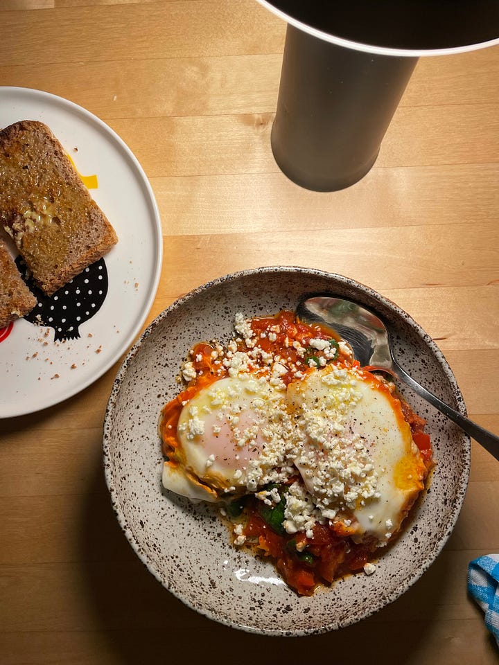 A bowl of lentil, lemon and silverbeet soup in a bowl with extra lemon. The second photo shows to poached eggs from a stovetop shakshuka, some wholemeal toast alongside.