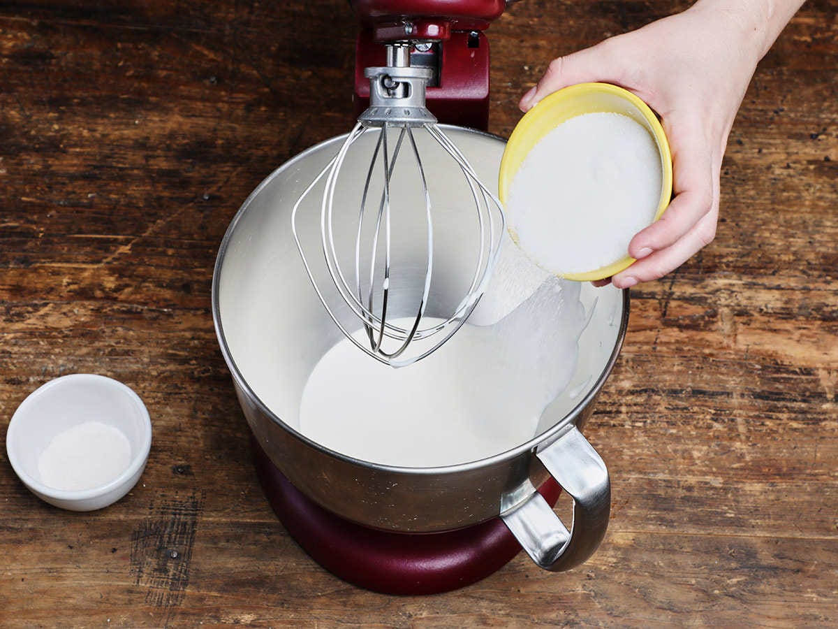 Pouring Sugar into Cream