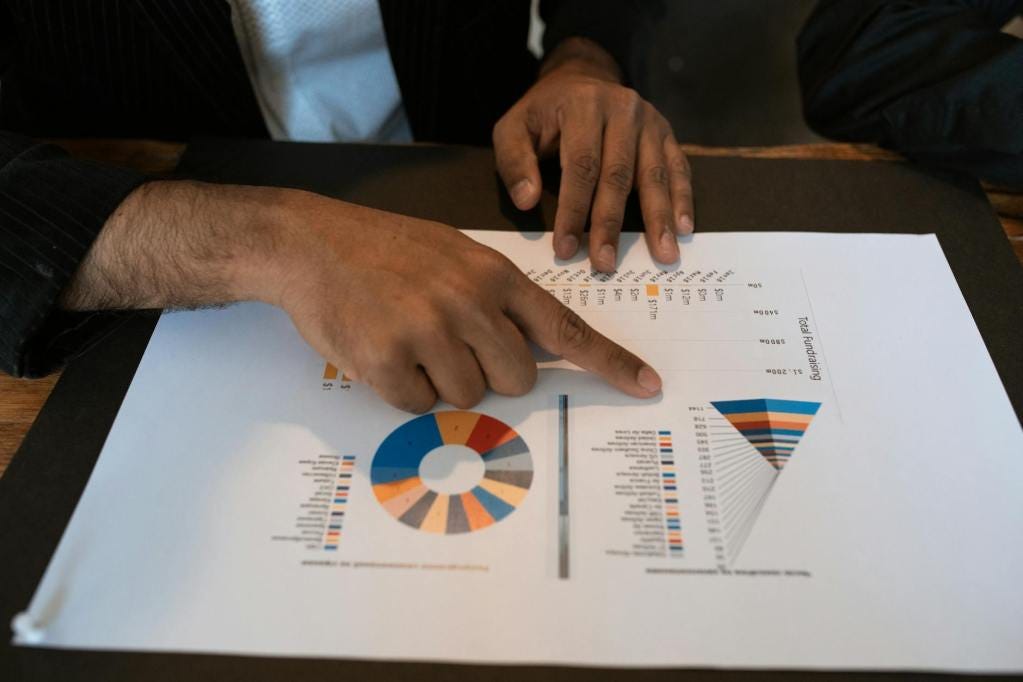person holding white printer paper