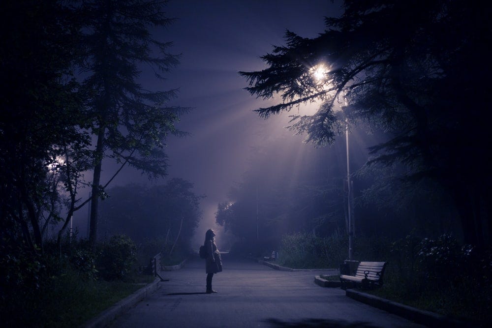 person looking at street lamp person looking at street lamp