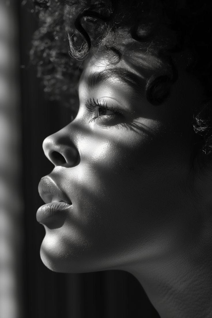 This may contain: a black and white photo of a woman's face with curls on her hair