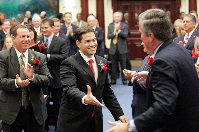 Marco Rubio greets Florida Governor Jeb Bush before being sworn in as the new Speaker of the Florida House in Tallahassee, November 21, 2006. Marco Rubio greets Florida Governor Jeb Bush before being sworn in as the new Speaker of the Florida House in Tallahassee, November 21, 2006.