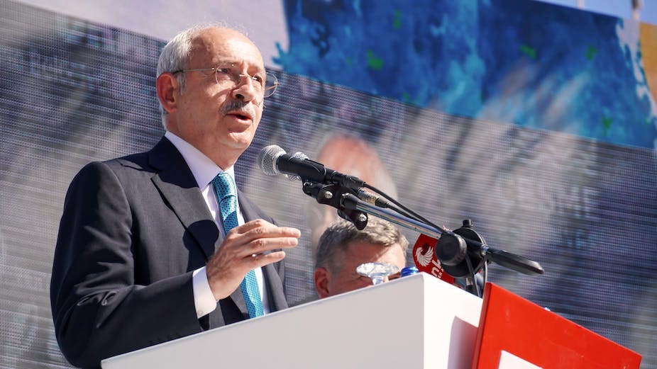 The Turkish opposition leader standing at a podium. The Turkish opposition leader standing at a podium.