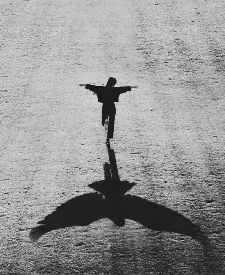 This may contain: a black and white photo of a person with their arms outstretched