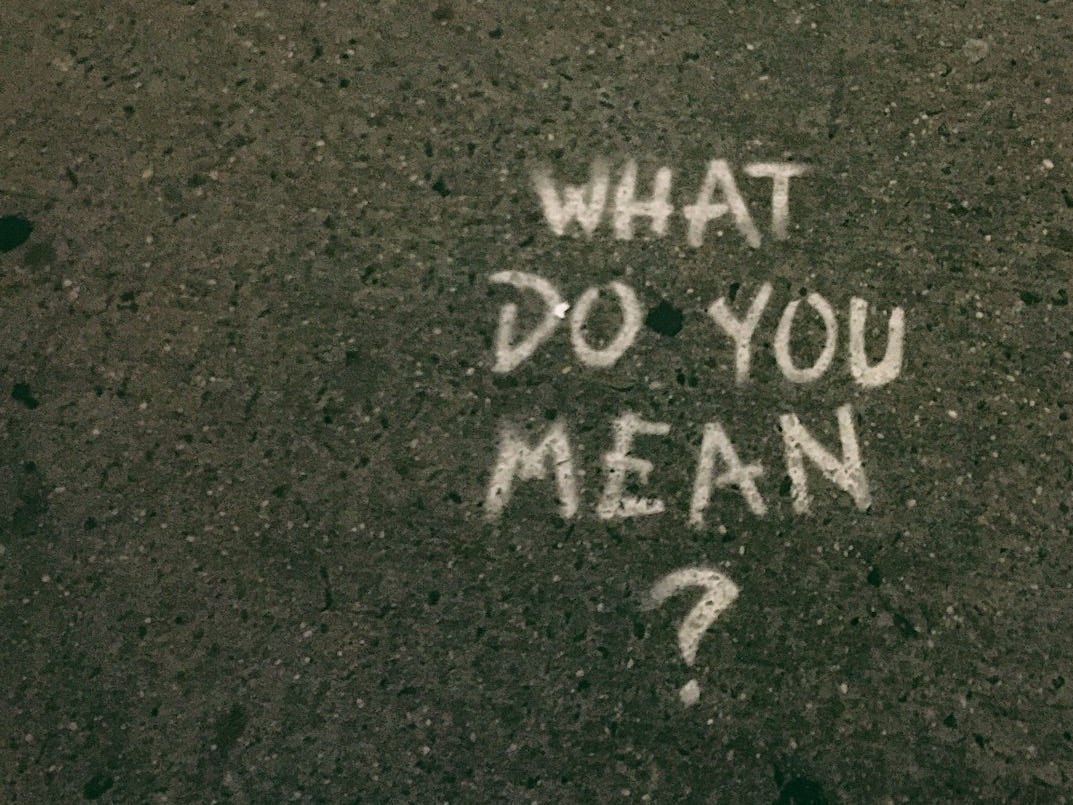 what do you mean? text on gray surface