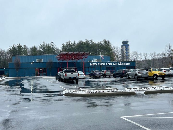snow, trees, parking lot, cars, signs