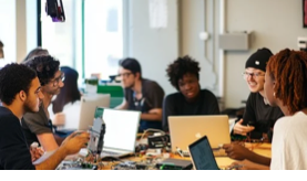 A group of people sitting around a table with laptops

AI-generated content may be incorrect.