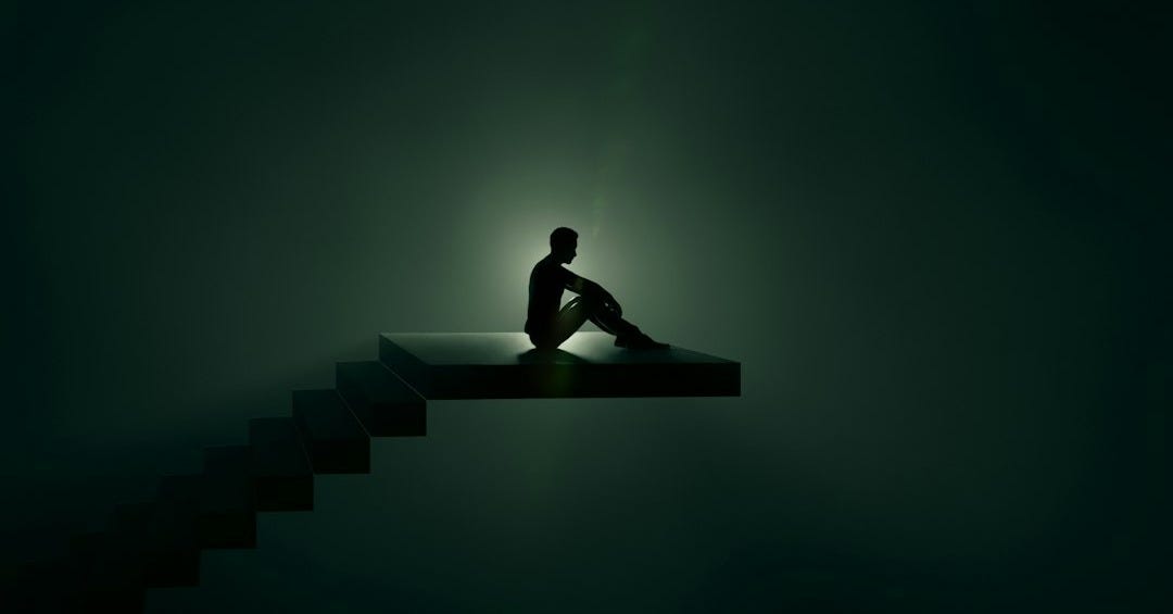 a person sitting on a bench a person sitting on a bench