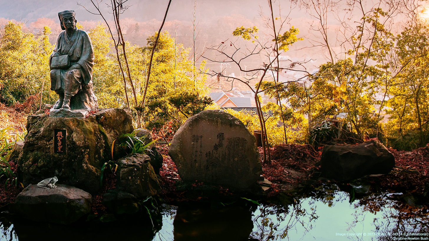Statue of the Japanese poet Basho oversees a composite image featuring an old pond with surreal rippled blue water and a companion frog on a nearby rock.