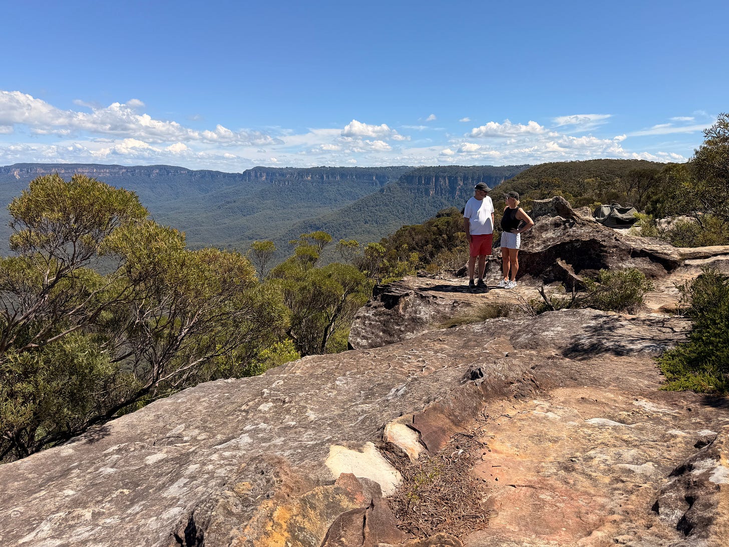 Kelly and Nigel looking at each other on a cliff overlooking the Blue Mountains. Kelly and Nigel looking at each other on a cliff overlooking the Blue Mountains.