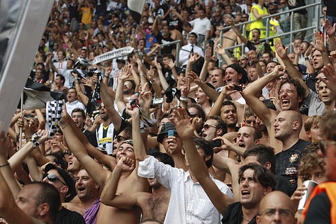 Juventus vs Parma, September 11, 2011: Arturo Vidal celebrates scoring on his debut, Juventus players embrace, fans erupt in celebration, Del Piero and teammates on the pitch, and Gianluigi Buffon giving a thumbs up during the opening match at Juventus Stadium.